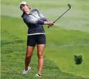  ?? Jonathan Ferrey / Getty Images ?? Leader Marina Alex keeps an eye on her shot from the rough on the 12th hole during Thursday’s first-round of the LPGA Cambia Portland Classic.