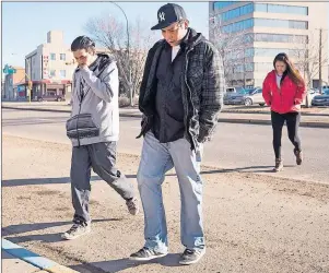  ?? CP PHOTO ?? William (left) and Jace Baptiste, brothers of Colten Boushie, walk in to the provincial court on the first day of preliminar­y hearing of Gerald Stanley’s case in North Battleford, Sask., Monday.