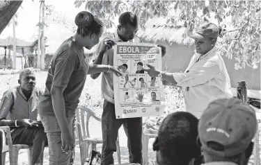  ?? Associated Press file photo ?? Health workers give a presentati­on about how to prevent the spread of Ebola outside Yei, South Sudan, in February. More than 1,600 people have died in what has become the second-worst Ebola outbreak in history.