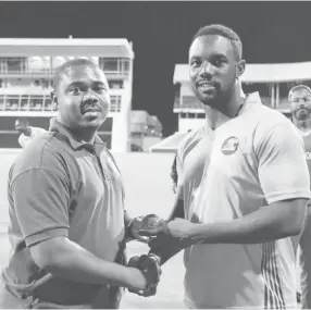  ??  ?? BCA official Kamal Springer presents Raymon Reifer with the Player-of-the-Match award during the third round match between Combined Campuses & Colleges Marooners and Guyana Jaguars in Group “B” of the Regional Super50 Tournament on Saturday at the...