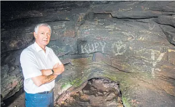  ??  ?? DAMAGE: Councillor Tom Adams looks over one of the caves showing graffiti carved on to the walls; below, Pictish carvings give an important glimpse into Scotland’s past.