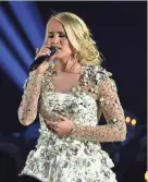  ?? IMAGES RICK DIAMOND/GETTY ?? Carrie Underwood performs during the “In Memoriam” segment of the 51st annual CMA Awards at the Bridgeston­e Arena in Nashville, Tenn., Wednesday.