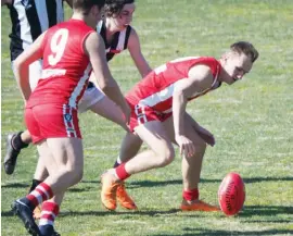  ??  ?? Above: Trafalgar’s Tom Tuck contests for the ground ball.The Bloods defeate Yinnar to advance straight into the grand final.Right: Jarvis Wheller collects the loose ball;Photograph­s: Paul Cohen.