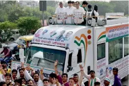  ?? — PTI ?? DPCC chief Ajay Maken and supporters atop a ‘ Metro bachao rath’ launched as part of “stop politics, save Metro” protests in New Delhi on Friday.