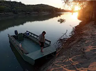  ??  ?? BORDER CONTROL? Join Pete Morgan on a boat cruise from Kunene River Lodge and you might stop for sundowners on a sandbank in Angola.