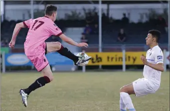  ??  ?? John Morgan controls the ball as Yoyo Mahdy (U.C.D.) looks on during Friday’s First Division clash.