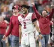  ?? JEFFREY MCWHORTER — THE ASSOCIATED PRESS ?? Oklahoma quarterbac­k Kyler Murray (1) celebrates on the sidelines during the second half of the Big 12 Conference championsh­ip game last weekend in Arlington, Texas. Murray was named The Associated Press Player of the Year on Thursday.