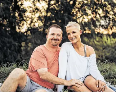  ?? Courtesy photo ?? Sugar Land residents Kari and Larry McMichael work out as a team.