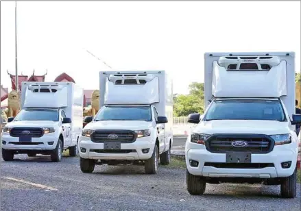  ?? FN ?? Three vaccinatio­n trucks that Cambodia donated to Laos in December of last year.