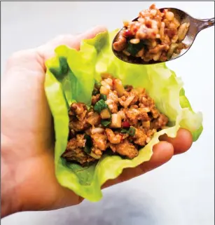 ??  ?? Asian Chicken Lettuce Wrap, from the cookbook “Complete Diabetes.”