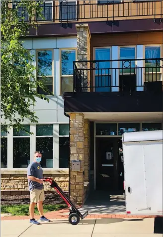  ?? COURTESY OF SHIPMYROOM ?? Ernie Magalotti, president and owner of ShipMyRoom and Legacy Logistics, helps Alvernia University students move their belongings off the Reading campus after the school closed to in-person learning for COVID-19.