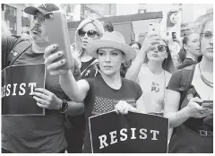  ?? — Reuters photo ?? Actress Milano attends a protest against Trump in Times Square, in New York City, New York, US, on Wednesday.