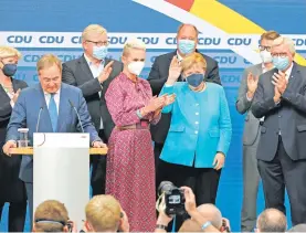  ?? ?? El CDU del candidato Armin Lashet y Angela Merkel no se dio por derrotado