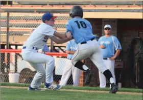  ?? AUSTIN HERTZOG - MEDIANEWS GROUP ?? Boyertown first baseman Chase Mercon tags out Post 625’s Tom Hegedus after a sacrifice bunt in the first round of the Pa. Region 2 tournament at Boyertown on July 19.