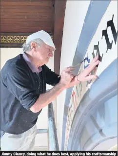  ?? (Pic: Bill Power) ?? Jimmy Clancy, doing what he does best, applying his craftsmans­hip to the lettering at Saint George’s.