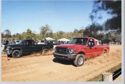  ??  ?? Jacob Rupp has been dialing his ’03 F-350 in for the dirt drags for a while now, and it’s starting to pay off. His standard cab, 7.3L Power Stroke was a forced to be reckoned with at Blackout in the Country, making passes in under 4 seconds. But what’s the secret behind Jacob’s 700-plus hp 7.3L? Big injectors, a big single turbo, good tuning, and a full nitrous bottle.