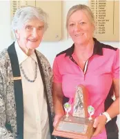  ?? ?? Edna Cropley presents the Edna Cropley tro- phy to winner Sharon Rippon.