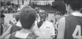  ?? NWA Democrat-Gazette/CHARLIE KAIJO ?? Rogers High School head coach Lamont Frazier talks to his players Friday during a game at Wolverine Arena at Bentonvill­e West in Centerton.