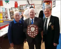  ??  ?? Wicklow’s team manager Mick Byrne receives the Paddy O’Leary Shield from Wexford officials Billy O’Connor and Mick Quigley.