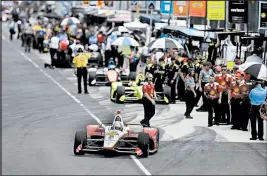  ?? DARRON CUMMINGS/AP ?? Josef Newgarden pulls out of the pits during practice for the Indianapol­is 500 IndyCar auto race at Indianapol­is Motor Speedway, May 17 in Indianapol­is.