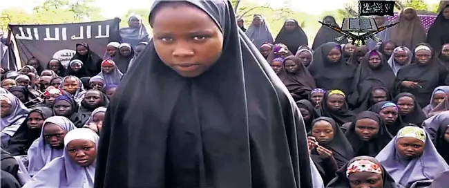  ?? Picture: AFP ?? RELUCTANT CONVERT: A video taken by Boko Haram this week shows a girl wearing a full-length hijab. The terrorist group said it would release the girls only in exchange for freed Boko Haram prisoners