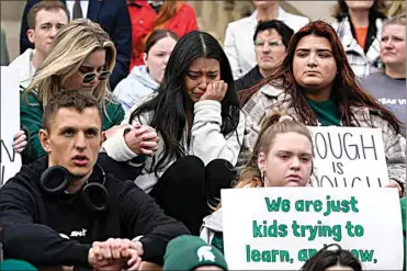  ?? PAUL SANCYA / AP ?? Current and former Michigan State University students rally at the capitol in Lansing, Mich. on Wednesday.