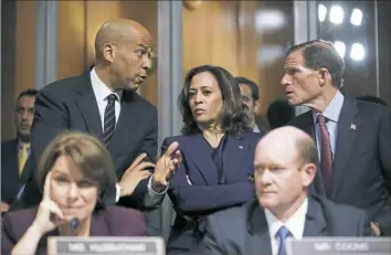  ?? Pablo Martinez Monsivais/Associated Press ?? Senate Judiciary Committee members, from top left, Cory Booker, D.-N.J.; Kamala Harris, DCalif.; and Richard Blumenthal, D-Conn., talk as Sen. Jeff Flake, R-Ariz., discusses his concerns before the committee Friday on Capitol Hill in Washington. Sen. Amy Klobuchar, DMinn., and Sen. Chris Coons, D-Del., are seated.