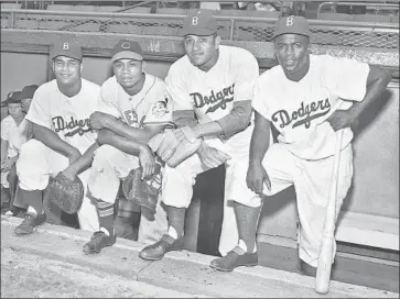  ?? Associated Press ?? NEWCOMBE, second from right, was one of the first four African Americans to integrate baseball’s All-Star game in 1949, along with, from left, Roy Campanella, Larry Doby and Jackie Robinson.