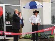  ?? THOMAS GNAU / STAFF ?? NASCAR legend Richard Petty (right) takes part in a ribbon-cutting ceremony for the new Spectrum Brands Global Auto Care center in Vandalia on Thursday. Petty has long used and pitched STP oil and petroleum products, one of Spectrum’s brands.