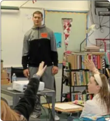  ??  ?? Former Pennsbury High School football player JJ Denman speaks to a Pennwood Middle School gym class Jan. 15.