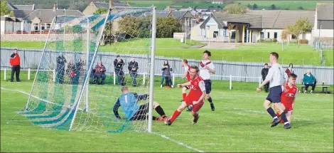  ?? Photograph­s: Danielle Christine Photograph­y ?? Donald McCallum celebrates after scoring the Pupils’ match-winning goal.