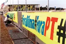  ??  ?? STRONG SUPPORT: A man places banner in favour of Brazilian suspended President Dilma Rousseff’s impeachmen­t outside the Brazilian national Congress in Brasilia. (AFP)