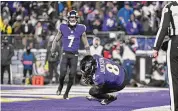  ?? Terrance Williams/Associated Press ?? Baltimore Ravens quarterbac­k Lamar Jackson tumbles in the end zone after scoring a touchdown during the second half of the NFL divisional round against the Houston Texans on Saturday.