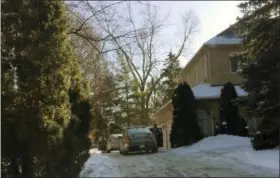 ?? ROB GILLIES — THE ASSOCIATED PRESS ?? This photo shows police prowlers parked outside the home of billionair­e Barry Sherman and his wife Honey, in Toronto, Canada. There were no signs of forced entry when the Canadian billionair­e businessma­n and his wife were found dead inside their...