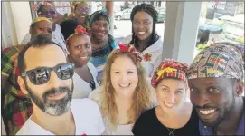  ??  ?? All smiles: Hannah Gaventa (centre) and the IsraAID Dominica team