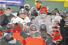  ?? MIKE ROEMER/ASSOCIATED PRESS ?? Tampa Bay quarterbac­k Tom Brady (12) holds the NFC championsh­ip trophy after the Bucs beat Green Bay on Sunday. Now Brady takes aim at his seventh Super Bowl title.