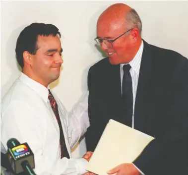  ?? MARK O'NEILL / POSTMEDIA NEWS FILES ?? Guy Paul Morin, left, shakes hands with Durham Police Chief Trevor McCagherty, who apologized to the wronged man on behalf of the force in August 1997, after Morin was exonerated of Christine Jessop's murder by DNA evidence.