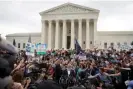  ?? 2015. Photograph: Bloomberg/Getty Images ?? Jim Obergefell, named plaintiff in the Obergefell v Hodges case, bottom center, speaks to the media after the supreme court’s same-sex marriage ruling on 26 June