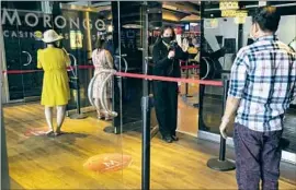  ?? Gina Ferazzi Los Angeles Times ?? TEMPERATUR­E CHECKS are required to enter Morongo Casino. The main f loor reached its new, limited capacity within three hours of opening Friday.
