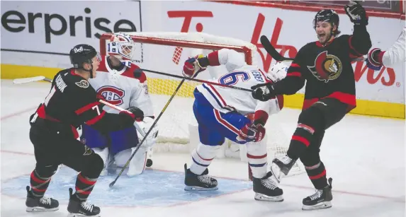  ?? ADRIAN WyLD/THE CANADIAN PRESS ?? Senators left wing Brady Tkachuk, left, races to congratula­te teammate Josh Norris, right, as he celebrates a goal Sunday night at Canadian Tire Centre.