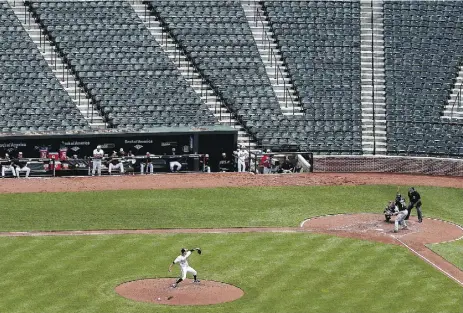  ?? Pat rick Smith / Gett y Imag es ?? Orioles starter Ubaldo Jimenez delivers to Chicago’s Jose Abreu at an empty Oriole Park at Camden Yards
Wednesday in Baltimore. Due to civic unrest, the two teams played in a stadium closed to the public.