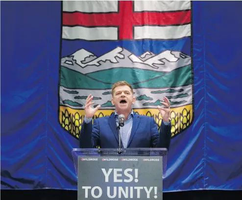  ?? DAVID BLOOM / POSTMEDIA NEWS ?? Wildrose leader Brian Jean gives a speech in Red Deer after it was announced his party was in favour of uniting with the Progressiv­e Conservati­ves. Ninety-five per cent of members of both parties supported the merger.