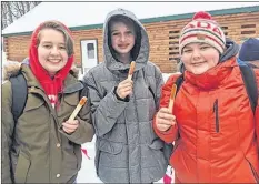  ?? SUBMITTED ?? Bridgette Hire, Kira Kennie and Zach Johnson try maple taffy.