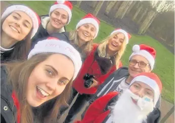  ??  ?? Family Cara with her sisters Mhairi, Iona, and Shoni, mum and dad Cat and Ewan, and family friend Flora McKeddie at the final event - the Santa run