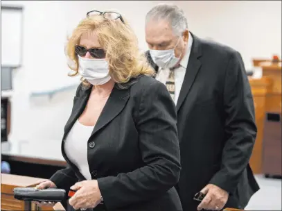  ?? Benjamin Hager Las Vegas Review-journal @benjaminhp­hoto ?? Patricia and Marcel Chappuis leave their pretrial hearing Monday in Beatty. The couple face charges of child abuse and neglect in connection with the now-closed Northwest Academy boarding school.