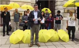  ?? Photograph: Benedict Rogers ?? British activist Benedict Rogers, who has been barred from Hong Kong, addressing a pro-democracy protest outside the UK foreign office in August.