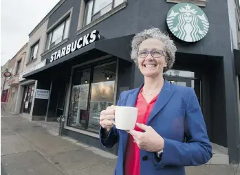  ?? PETER J. THOMPSON/NATIONAL POST ?? Starbucks Canada president Rossann Williams stands at the Bloor Street West location in Toronto Thursday, where an expanded menu including alcoholic beverages will be available from 2 p.m. onward each day