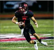  ?? NICK GRAHAM / STAFF ?? Lakota West High School quarterbac­k Mitch Bolden threw for 206 yards and three touchdowns Friday night as the Firebirds pulled away from Milford 49-14 to win a playoff game.