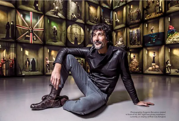  ??  ?? Photograph­er Eugenio Recuenco seated in front of his 365° light-box photo installati­on,
currently on display at River City Bangkok