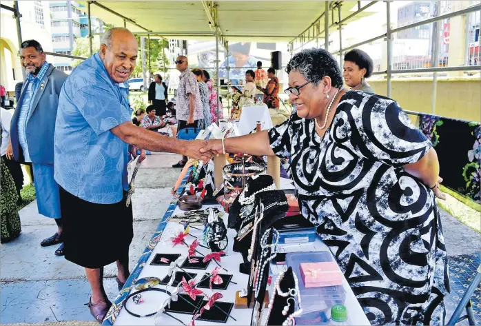  ?? Picture: JONA KONATACI ?? Minister of iTaukei Affairs Ifereimi Vasu meets Kalesi Bale during the Internatio­nal Mother Language Day in Suva on Wednesday.